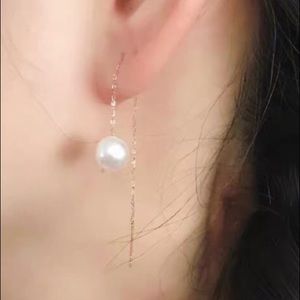 18 k yellow solid gold real pearl earrings.